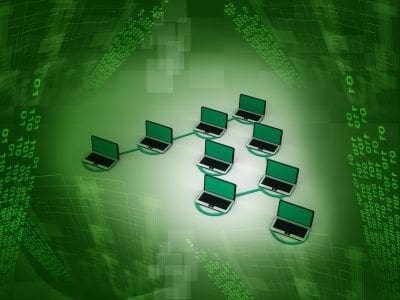A hierarchical network of nine laptops on a green binary background, visually representing measurable cyber risk and valuation factors.